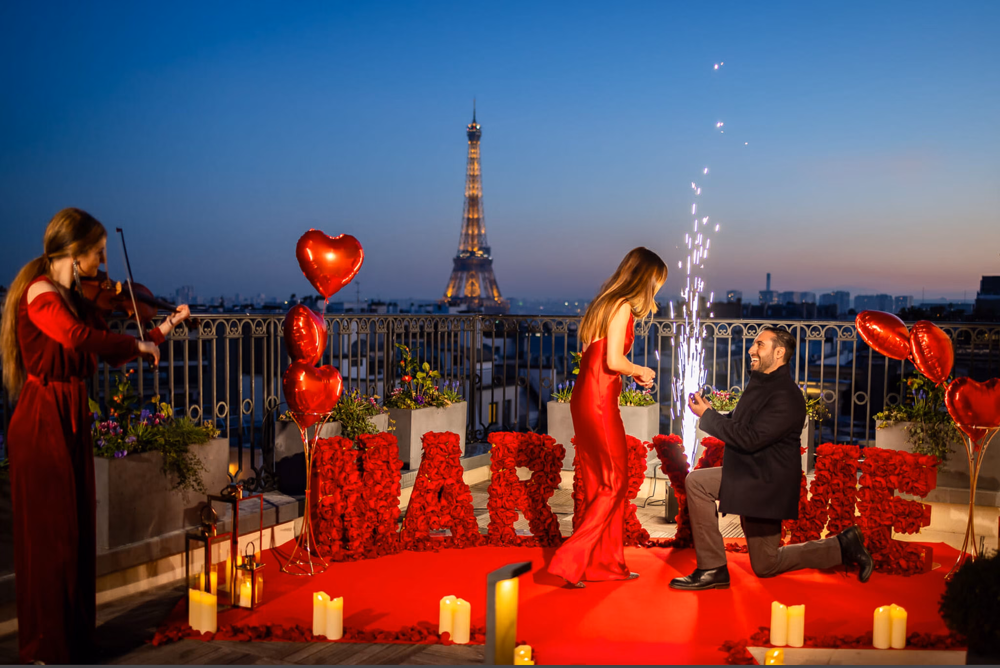 Proposal at The Peninsula Paris Secret Table Rooftop with Eiffel Tower view, violinist, red rose décor, candles, and a firework column.