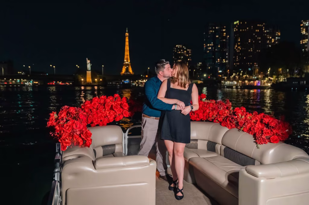 Paris night proposal on the Seine — red roses, the Eiffel Tower lit up, and a kiss with the whole city watching.